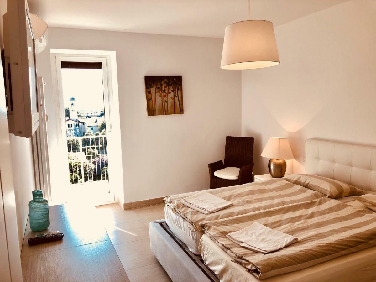 Apartamento Attico Palazzo Di Vetro Luino Exterior foto